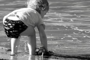 Toddler playing at the beach